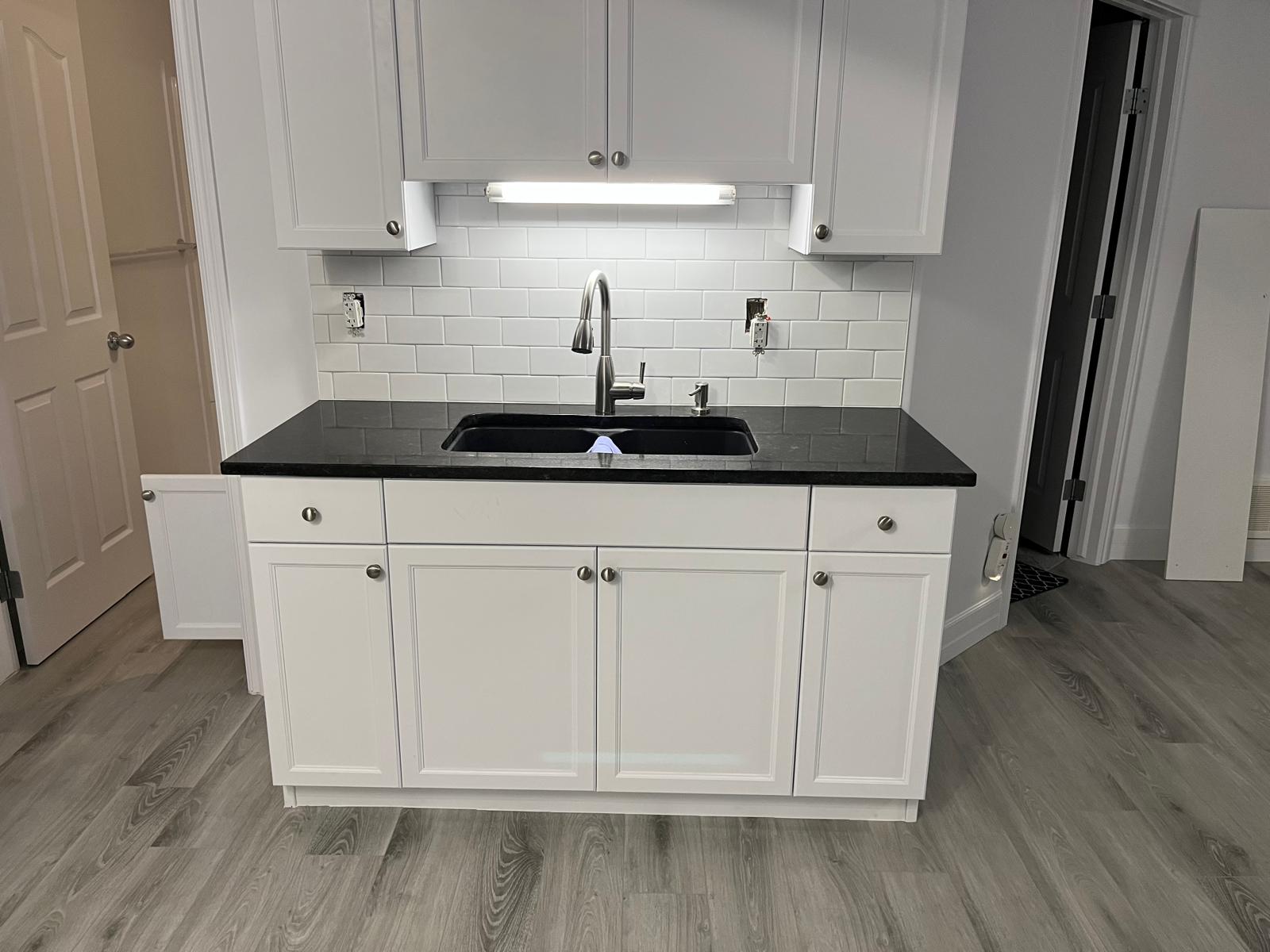 Kitchen Sink, Cabinets, and Tile Backsplash