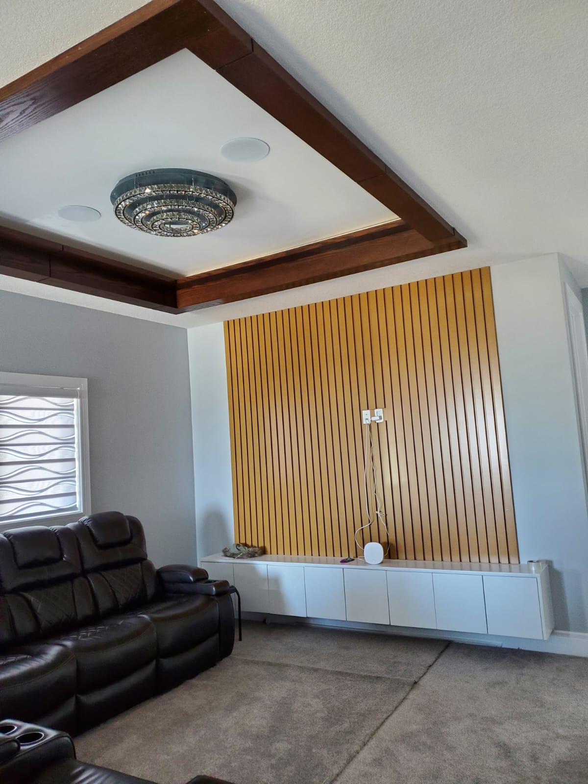 Custom wood-slat living room by ALZ Quality Renovations